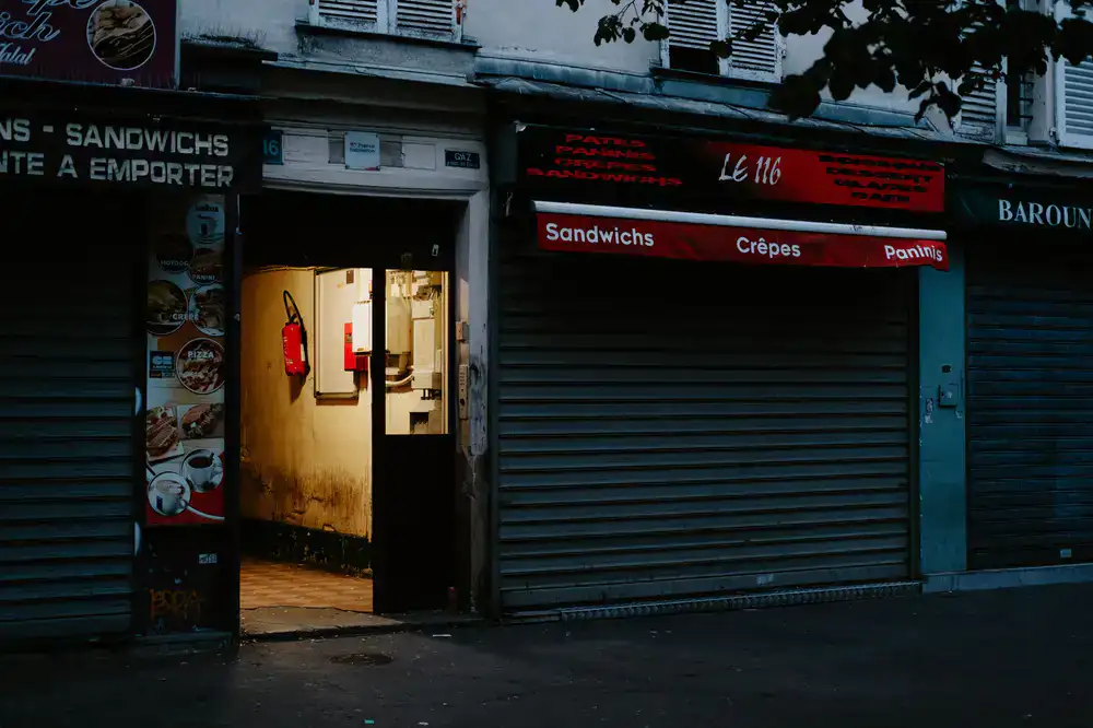Brightly lit exterior of the board game cafe showing the entrance