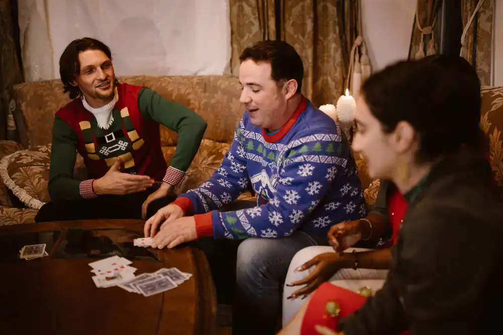 Friends laughing while playing a fast-paced card game